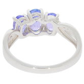 Elegant oval blue tanzanite sterling silver ring featured from the back with sparkling accents.